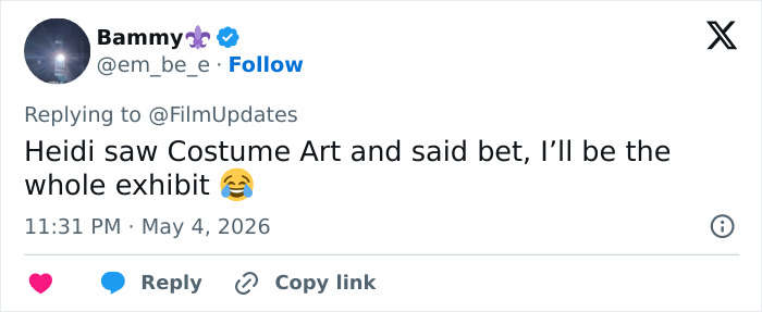 A tweet about Heidi Klum's Met Gala outfit being genuinely disturbing, featuring a laughing emoji.