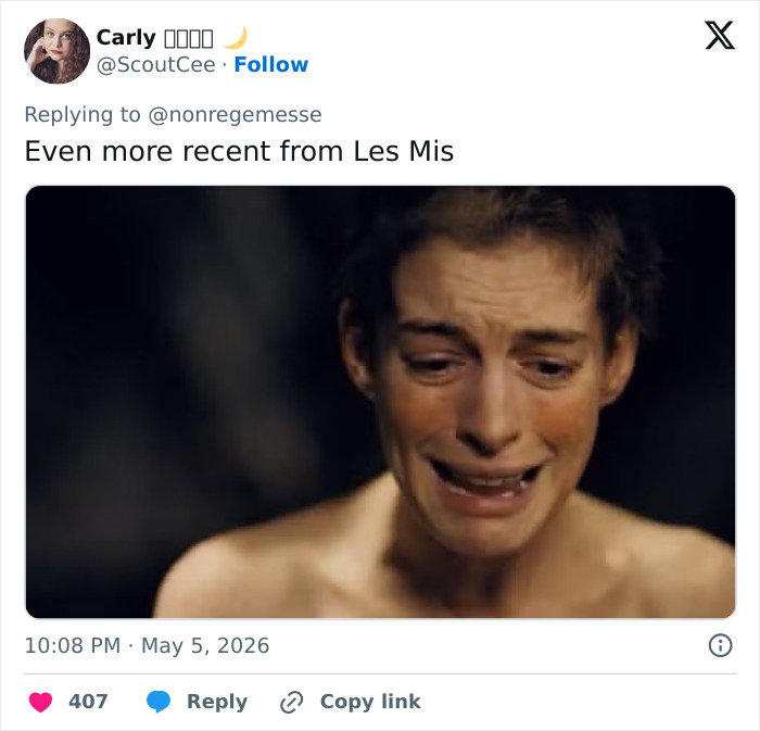 Anne Hathaway deeply crying in 'Les Mis&eacute;rables', showcasing her acting range and stirring wild reactions.