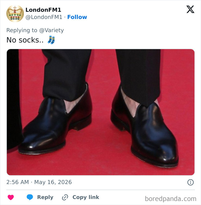 Close-up of John Travolta's black dress shoes without socks on red carpet