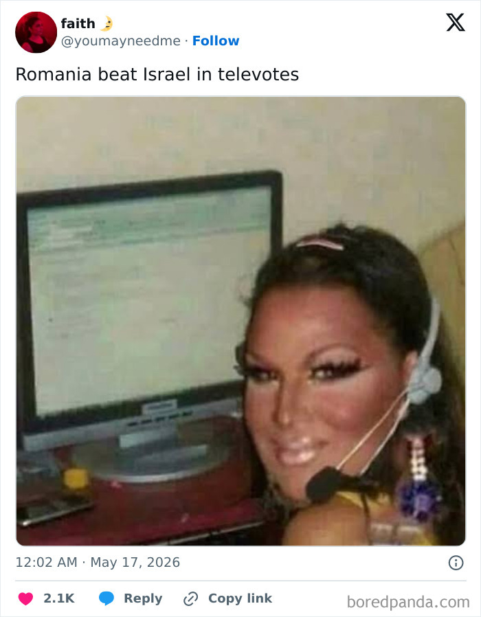 Person smiling in front of computer screen reacting to Romania beating Israel in televotes Eurovision