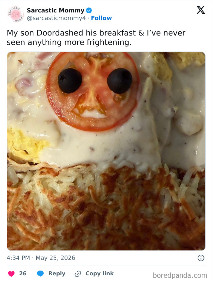 Funny parenting breakfast with tomato and olives face on food
