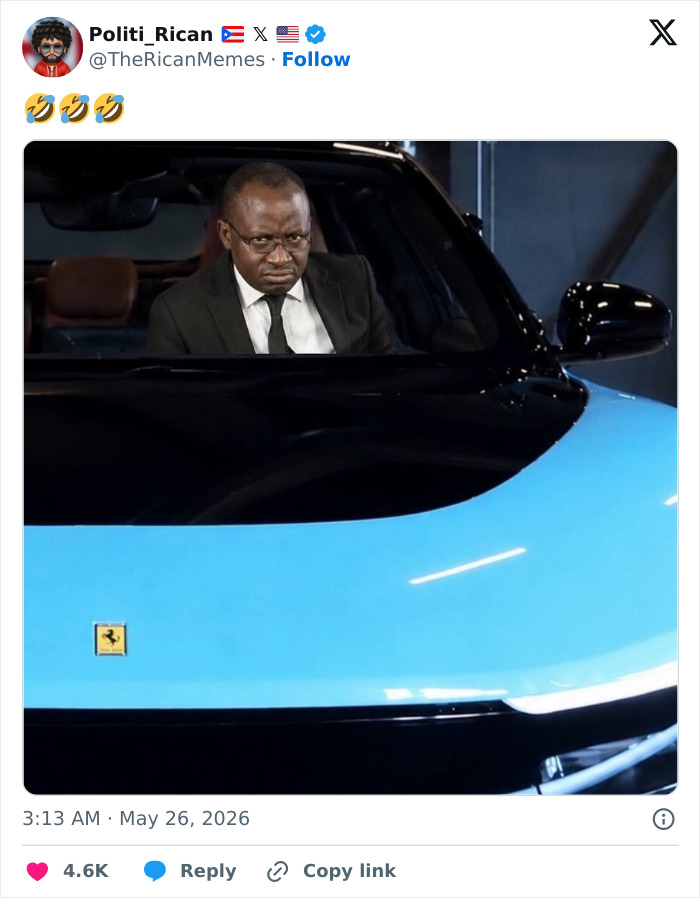 Man looking unimpressed inside blue Ferrari electric car luxury vehicle