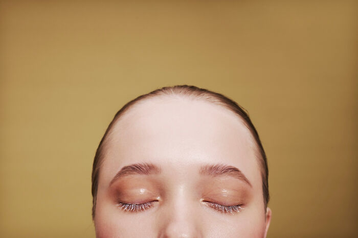 A person's closed eyes and forehead, suggesting reflection or experience. People cross to the other side and come back with stories.