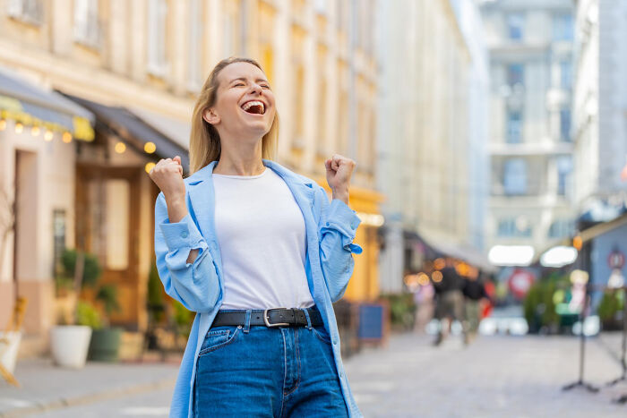 Happy woman outdoors after psychiatric facility stay