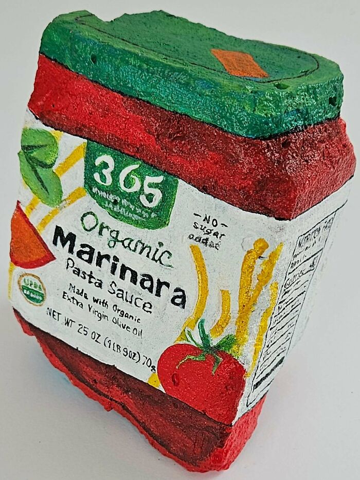A colorful stone creation painted as a 365 Organic Marinara Pasta Sauce container, showcasing iconic foods.