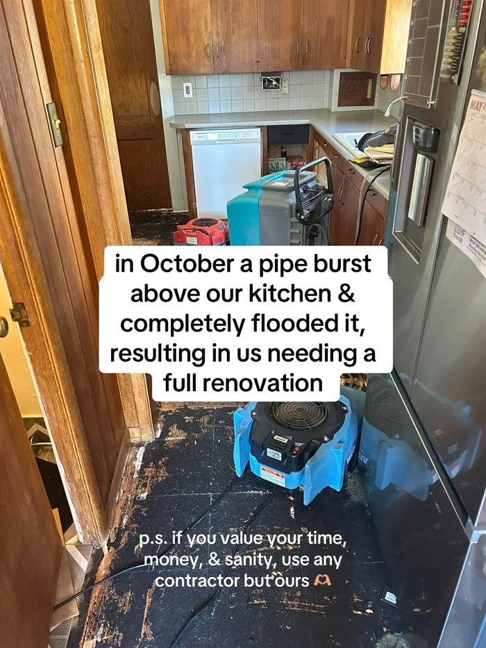Flooded kitchen with water damage remediation equipment and a very expensive contractor message.