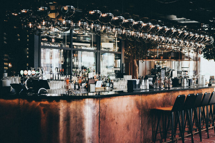 Bar interior with bottles and glasses, unrelated to psychiatric facility