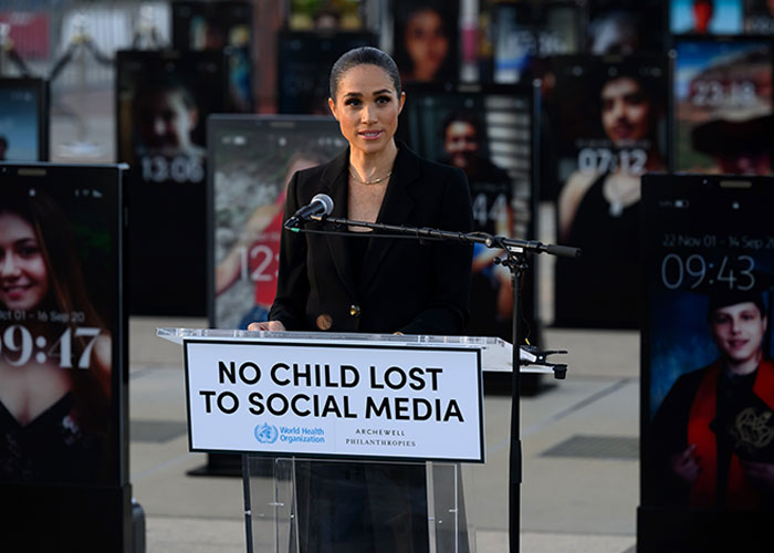 Meghan Markle speaking at WHO event on children's online safety with No Child Lost to Social Media sign Meghan Markle speaking at WHO event on children's online safety with No Child Lost to Social Media sign