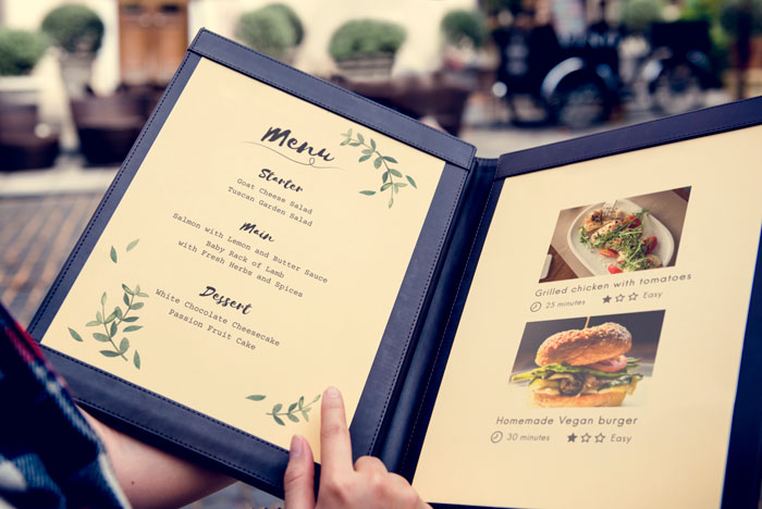 Menu with artisanal dishes and descriptions in restaurant