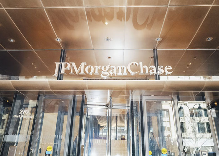 JPMorgan Chase building entrance with logo above glass doors JPMorgan Chase building entrance with logo above glass doors