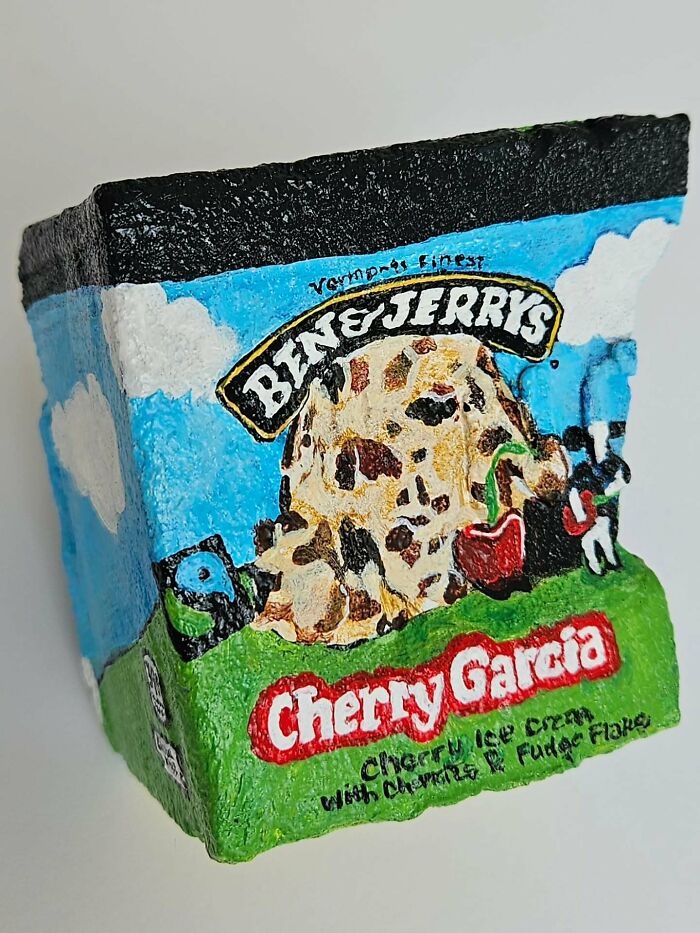 A colorful stone creation of a Ben & Jerry's Cherry Garcia ice cream pint, turning rocks into iconic foods.