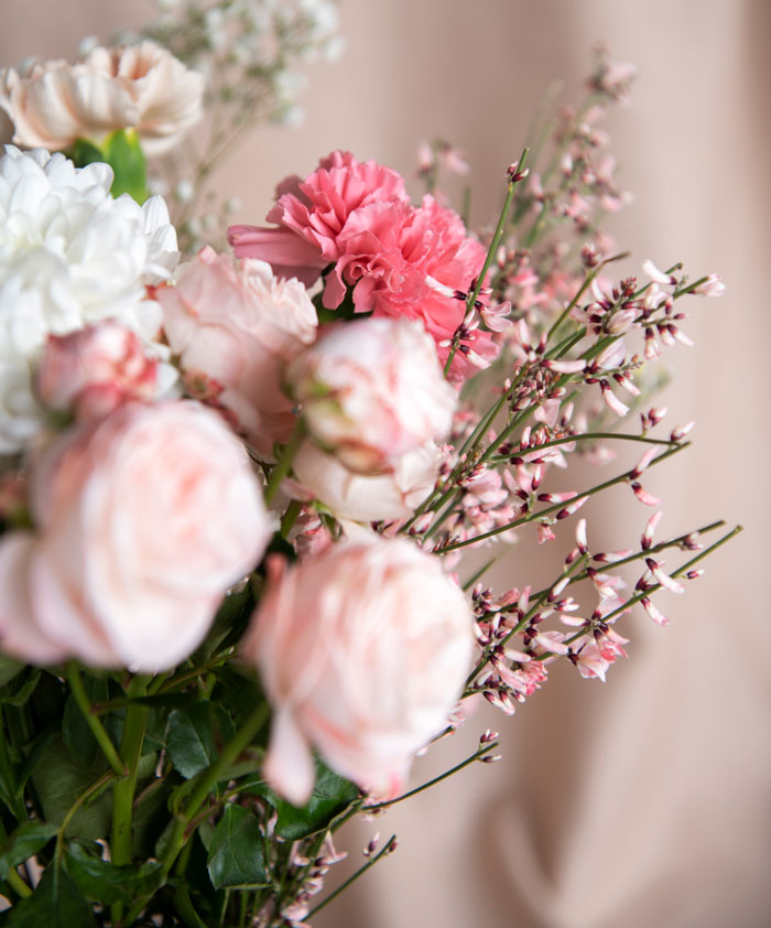 Close-up of pink and white flowers in a floral bouquet