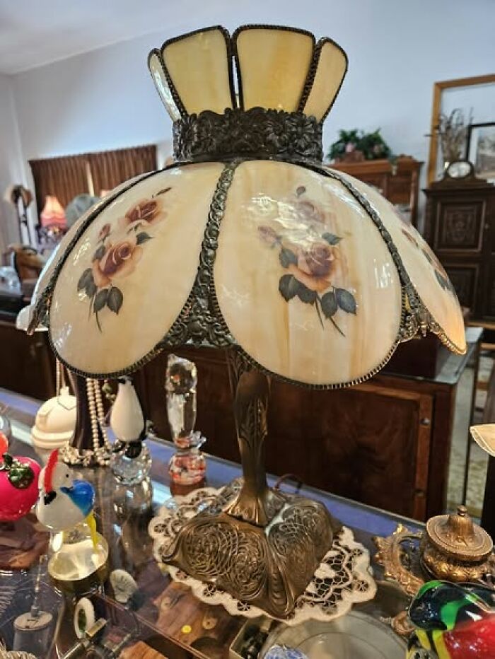Decorative vintage secondhand lamp with floral design and yellow glass panels