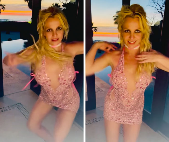 Britney Spears dancing energetically in a sheer pink dress outdoors