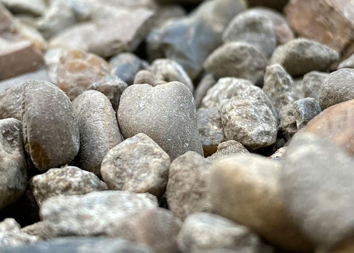 Close-up of small stones and pebbles on the ground.
