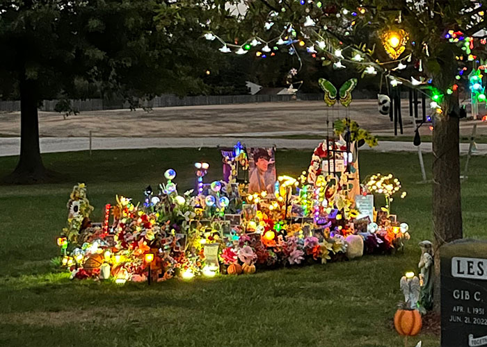 Memorial site lit with flowers and decorations for Mackenzie Shirilla story