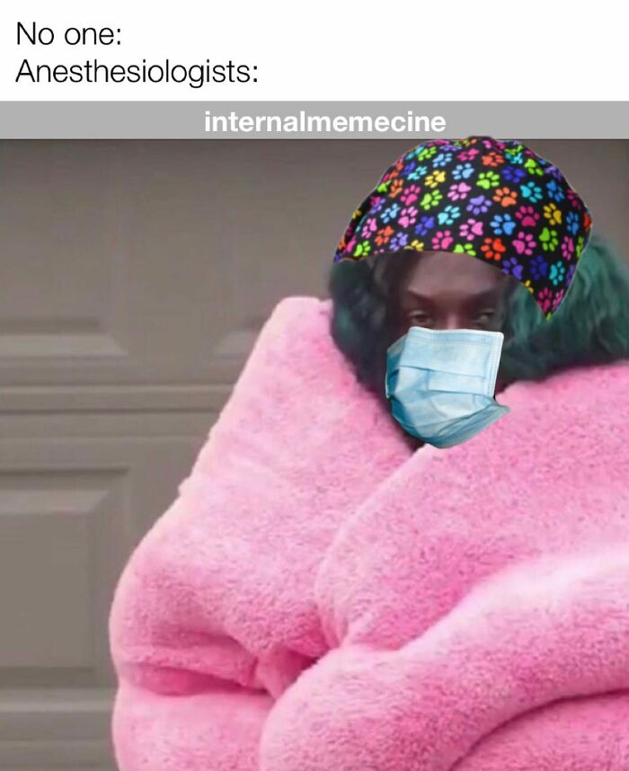 A person in a pink fluffy coat, medical mask, and colorful paw print scrub cap, portraying a medical meme.