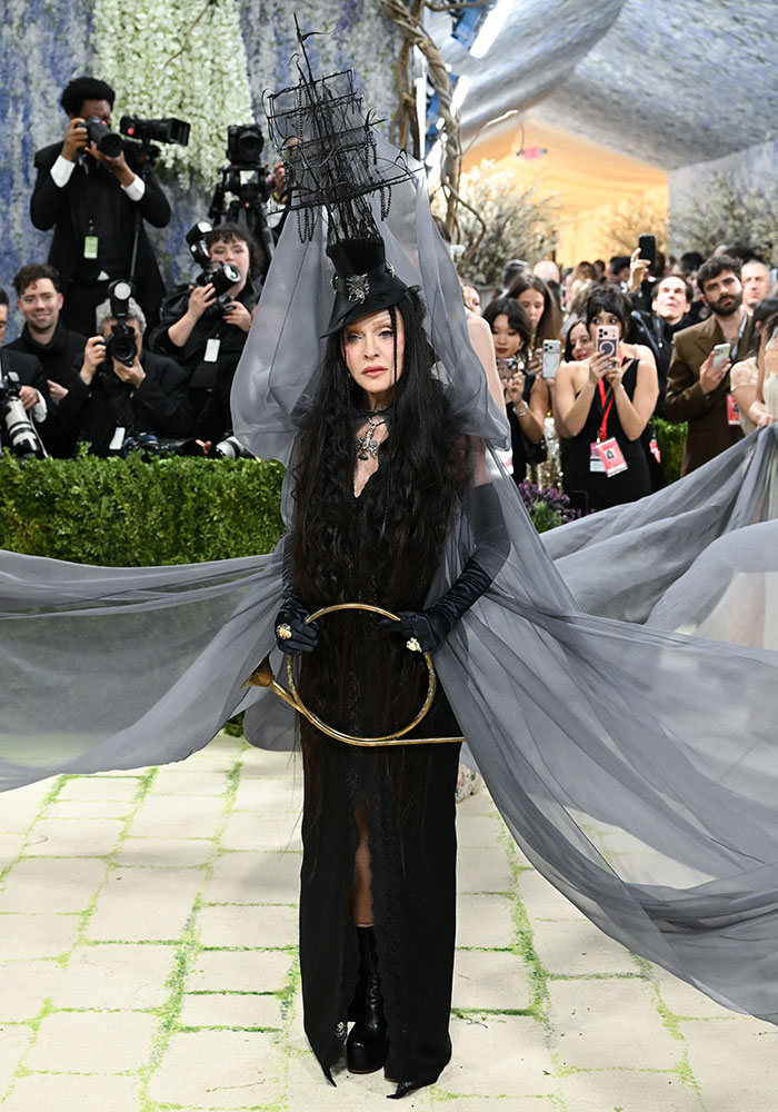 A woman with a ship hat and long black hair on the Met Gala red carpet, among the worst dressed stars.