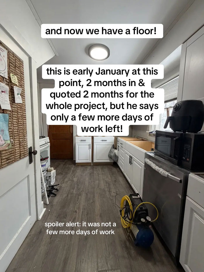 A kitchen undergoing renovation with new flooring and partially installed white cabinets. A very expensive contractor left this home in disarray.