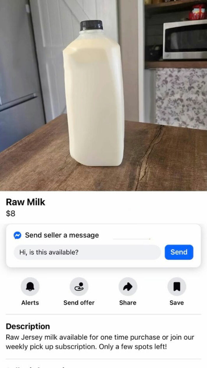 Container of raw Jersey milk on wooden table