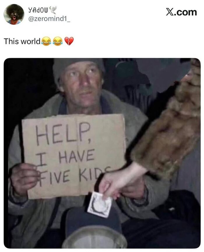 Homeless man holding a sign about five kids with a hand giving him money