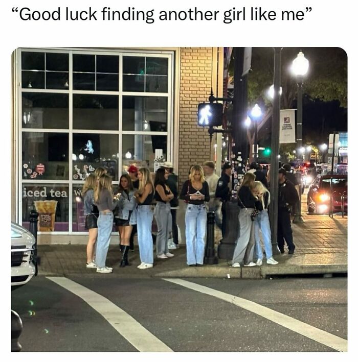 Group of people standing at a crosswalk with caption about finding a girl like me