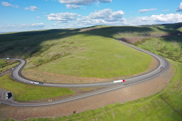Curvy mountain highway with tight turns challenging truck drivers on dangerous road