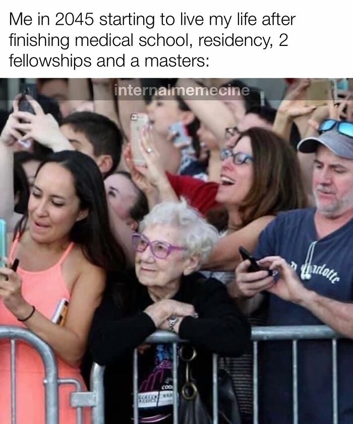Medical meme showing a crowd with an elderly woman looking content, illustrating the long journey to becoming a doctor.