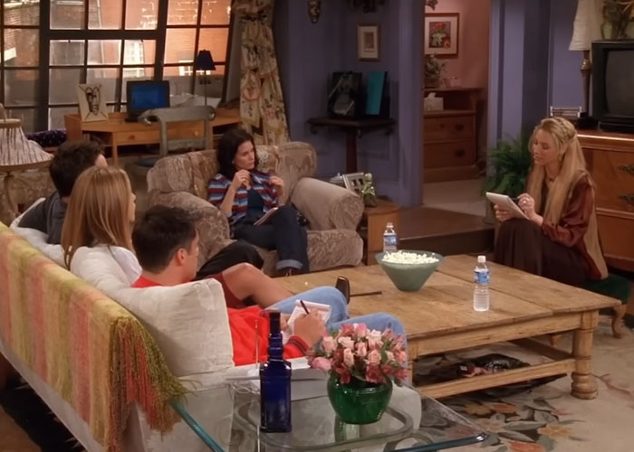 Friends cast in Monica's apartment. Phoebe writes, others relax. Debunking US stereotypes and misconceptions about Americans.