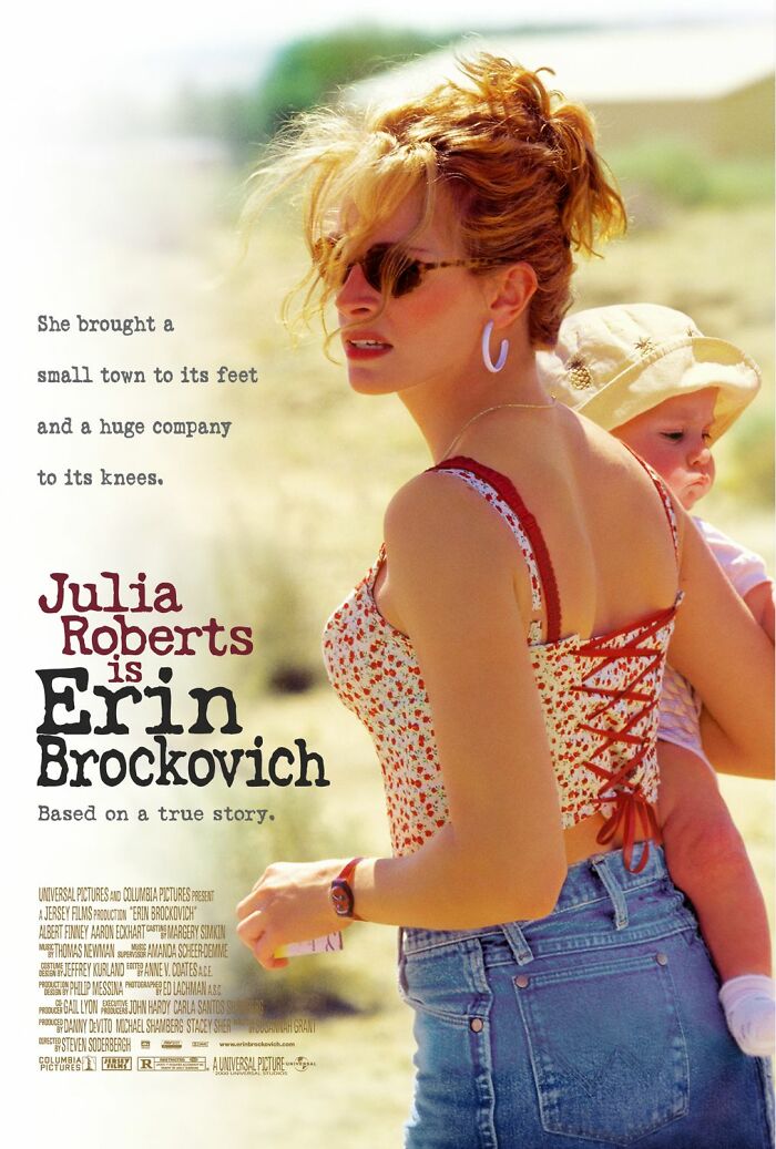 Erin Brockovich movie poster with Julia Roberts carrying a baby outdoors