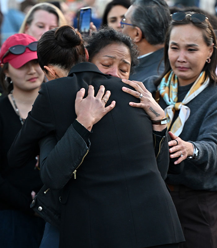 Meghan Markle hugging emotional woman surrounded by crowd on social media safety campaign