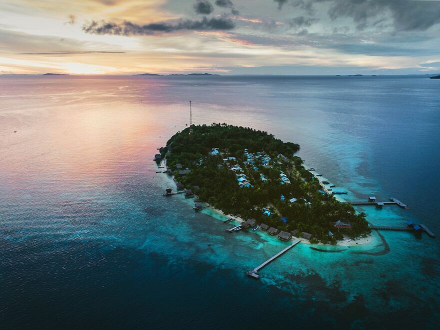 Aerial view of a small island at sunset, representing one of the smallest countries in the world