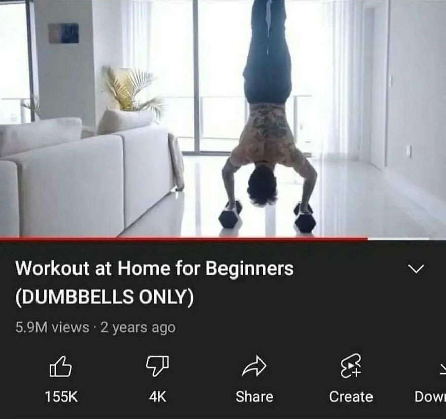 Man doing handstand dumbbell workout at home for beginners
