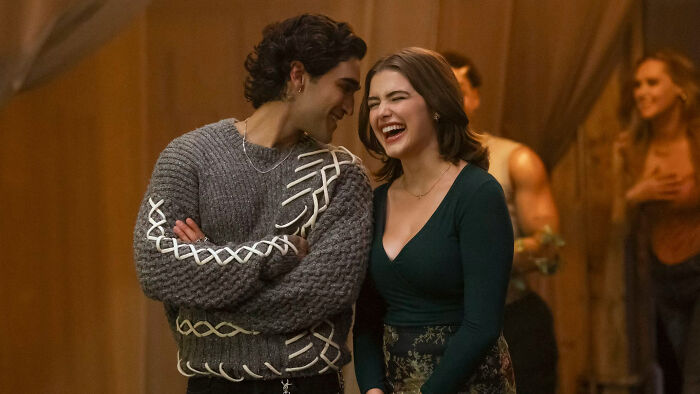 Off Campus star sharing laugh with co-star during scene Off Campus star sharing laugh with co-star during scene