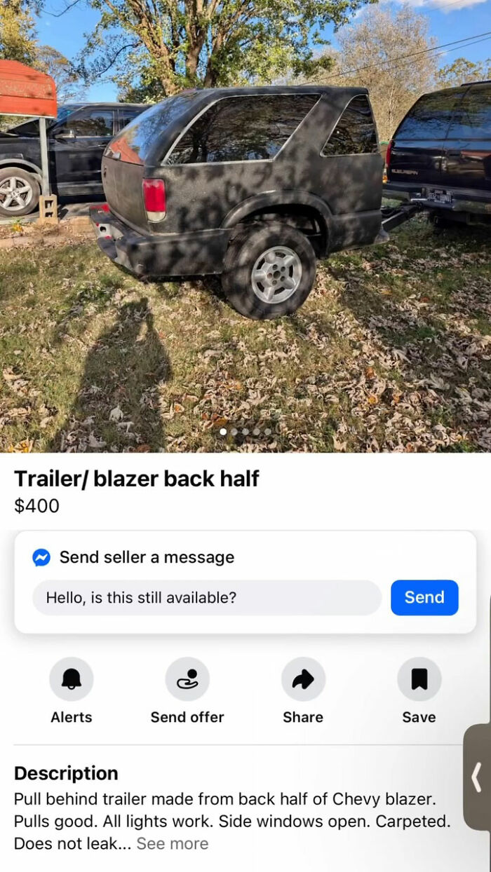 Trailer made from back half of Chevy Blazer parked on grass