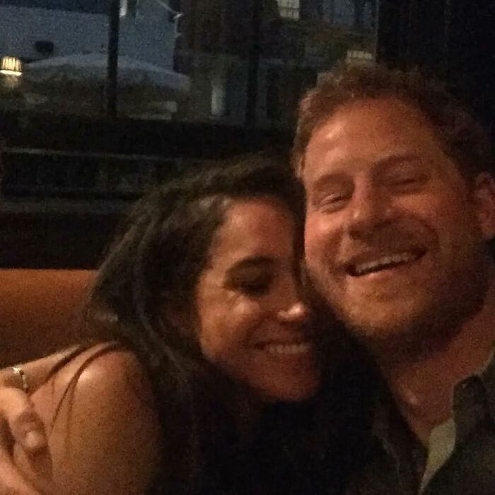 Casual close up of Meghan Markle and Prince Harry smiling together