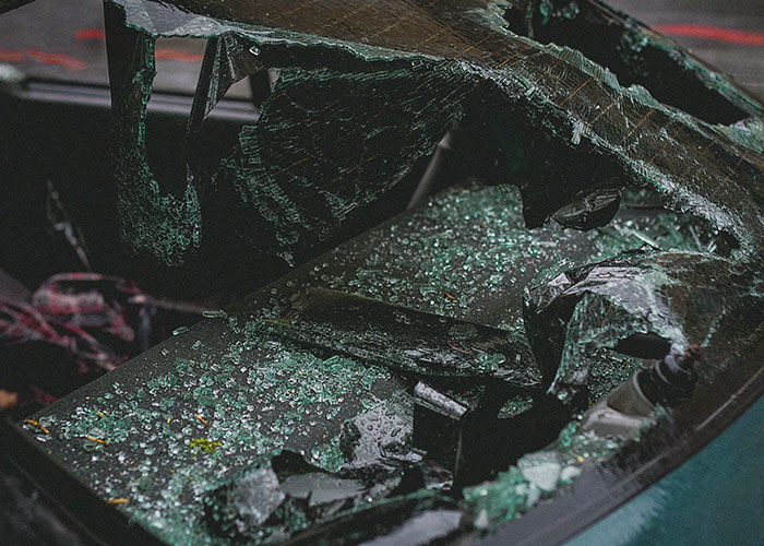 Shattered car windshield indicating accidents linked to mysterious vanishings