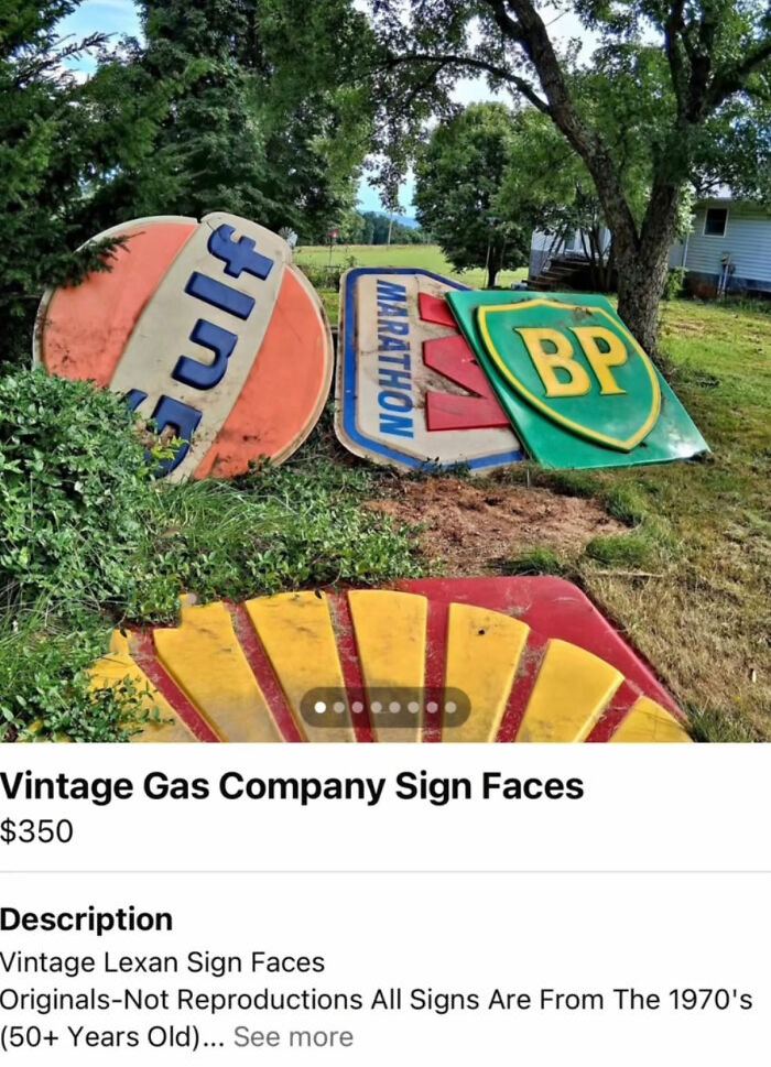 Collection of vintage gas company sign faces from the 1970s outdoors