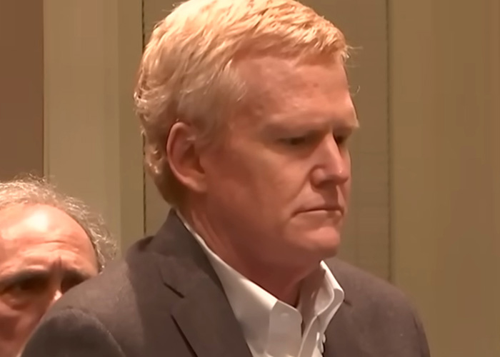 Close-up of a serious man in courtroom related to infamous crime convictions