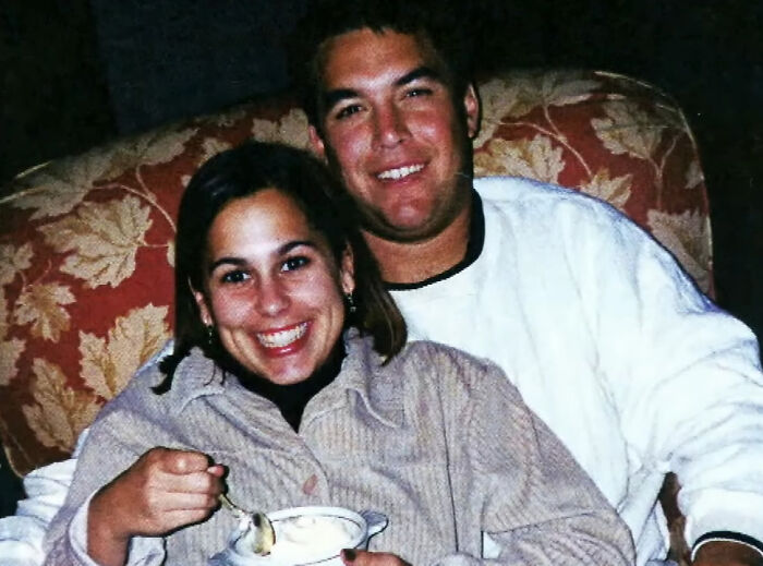 Couple smiling on couch in infamous crime convictions story
