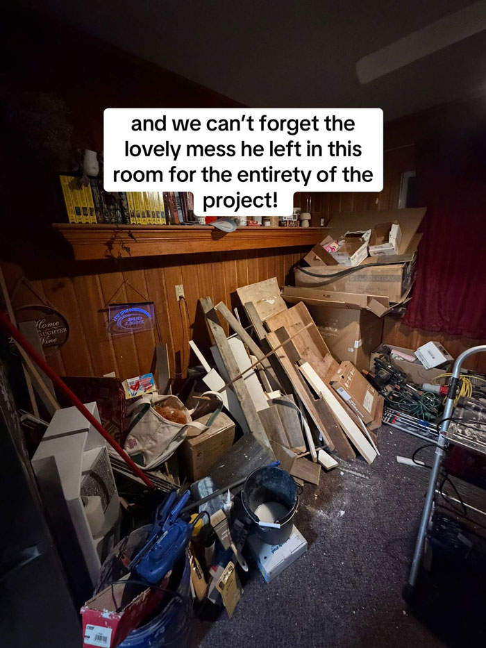 A room in disarray with wood scraps, boxes, and tools piled on the floor and a shelf above. A very expensive contractor left this mess.