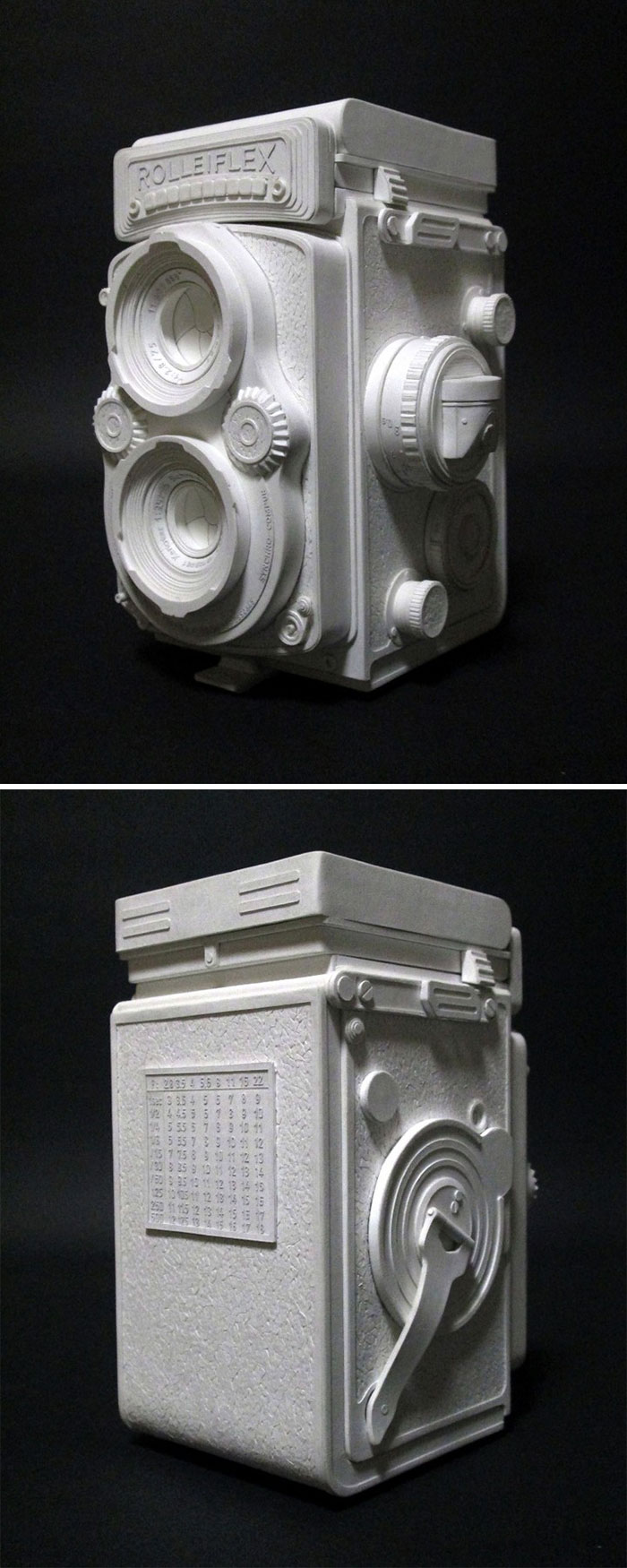 Detailed paper camera model with dual lenses and intricate textures