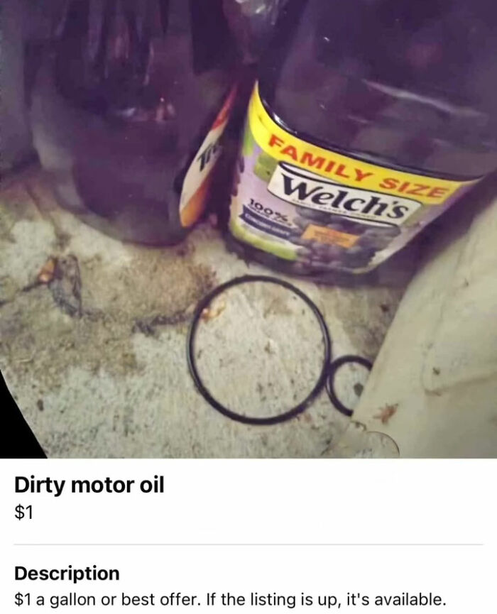 Dirty motor oil container next to juice bottle on stained floor
