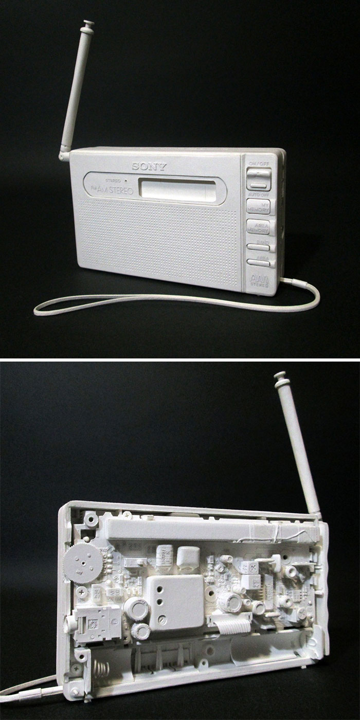 White paper radio with antenna and detailed buttons on side