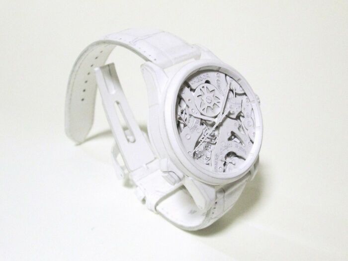 Detailed paper watch showing intricate mechanical gears