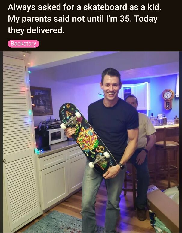 A happy man holding a new skateboard, fulfilling a childhood wish. A positive post for making your day.