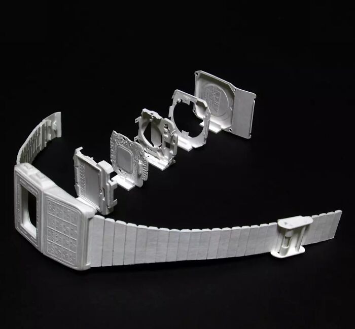Exploded view of paper watch showcasing intricate internal layers and components