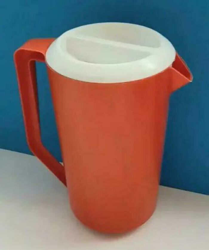 An orange plastic pitcher with a white lid, a recognizable throwback meme for 90s kids.