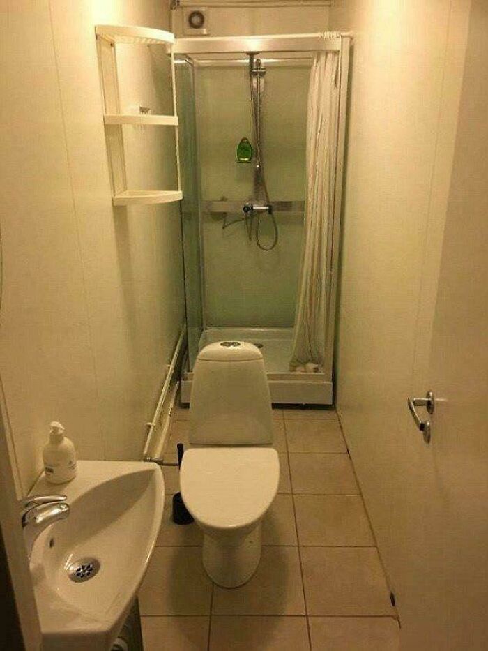 Narrow bathroom with toilet, sink, and shower illustrating questionably designed bathrooms