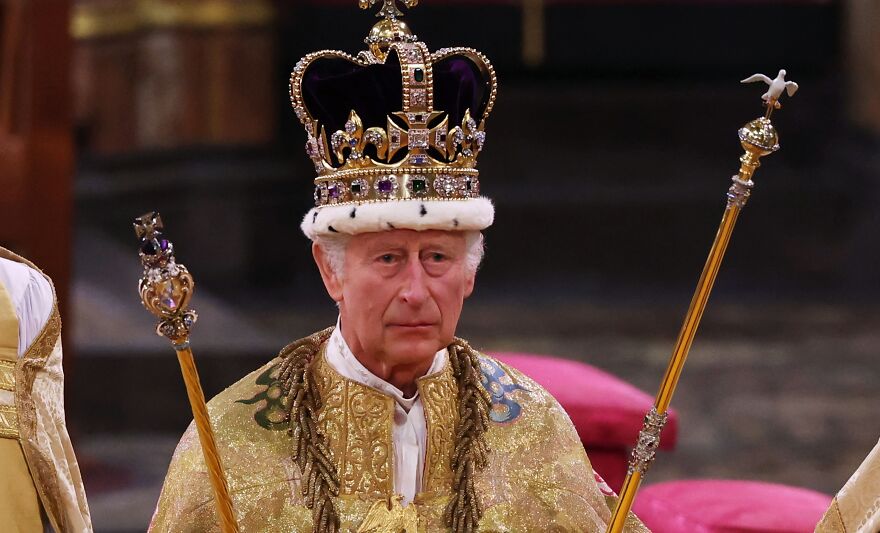 Man in formal military uniform saluting during a ceremony, representing oldest surviving monarchies in the world.
